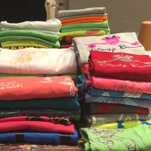 An assortment of Disney and Universal t-shirts